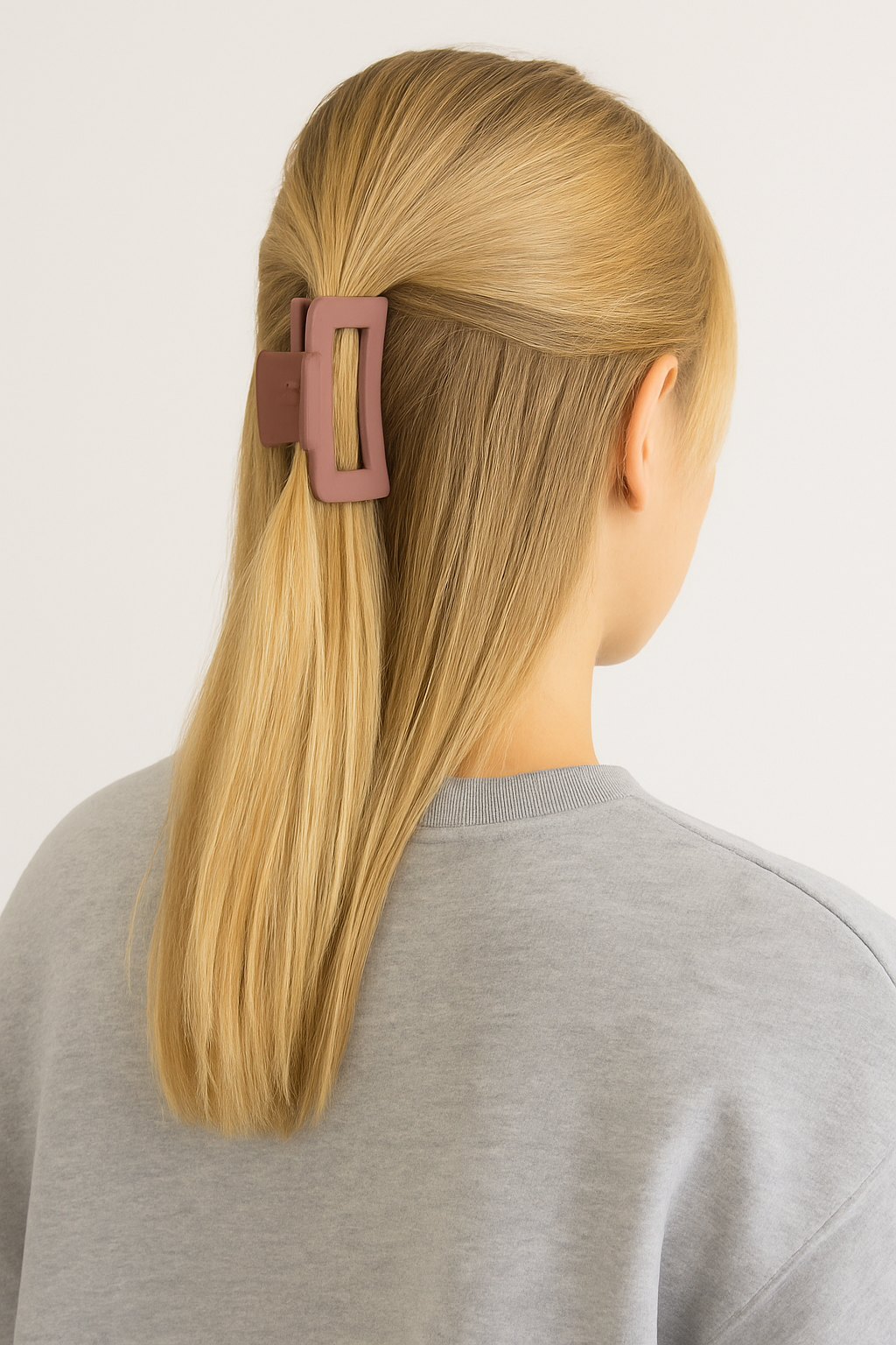Matte rectangle hair claw clip in mauve securing half-up hairstyle on blonde hair by BLURZ